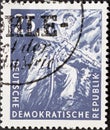 GERMANY, DDR - CIRCA 1957 : a postage stamp from Germany, GDR showing a miner underground with a hammer drill