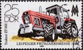 GERMANY, DDR - CIRCA 1980 : a postage stamp from Germany, GDR showing a modern large tractor `ZT 303`. Leipzig Spring Fair 1980