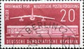 GERMANY, DDR - CIRCA 1958 : a postage stamp from Germany, GDR showing a modern rail mail car, GDR turbine airliner `B 152`. Post