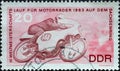 GERMANY, DDR - CIRCA 1963 : a postage stamp from Germany, GDR showing a motorcycle racer in a motorcycle race, 125 cc class. Worl