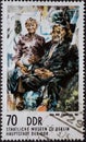 GERMANY, DDR - CIRCA 1974 : a postage stamp from Germany, GDR showing My parents III; Willi Sitte 1921Ã¢â¬â2013. State Museums Berli