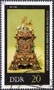 GERMANY, DDR - CIRCA 1975: a postage stamp from Germany, GDR showing an old Stutzuhr Hubertusuhr by Johann Heinrich KÃÂ¶hler and J Royalty Free Stock Photo