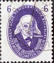 GERMANY, DDR - CIRCA 1950: a postage stamp from Germany, GDR showing a portrait of the historian Theodor Mommsen. 250 years of the Royalty Free Stock Photo