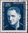 GERMANY, DDR - CIRCA 1957 : a postage stamp from Germany, GDR showing a portrait of the playwright and poet Bertolt Brecht. blue Royalty Free Stock Photo