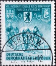 GERMANY, DDR - CIRCA 1955 : a postage stamp from Germany, GDR showing Racing cyclist, coat of arms of Prague, Berlin, Warsaw. VII