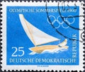 GERMANY, DDR - CIRCA 1960 : a postage stamp from Germany, GDR showing a sailboat in the wind with a single-handed sailor. Text: O