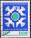 GERMANY, DDR - CIRCA 1965 : a postage stamp from Germany, GDR showing some peace doves around earth globe, flag of Finland. World