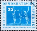 GERMANY, DDR - CIRCA 1959 : a postage stamp from Germany, GDR showing some women doing gymnastics with clubs. German Gymnastics an