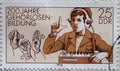 GERMANY, DDR - CIRCA 1978 : a postage stamp from Germany, GDR showing a student with headphones electro-acoustic hearing aid an