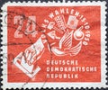 GERMANY, DDR - CIRCA 1950: a postage stamp from Germany, GDR showing Symbols from the world of work with dove of peace and ballot