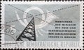 GERMANY, DDR - CIRCA 1958 : a postage stamp from Germany, GDR showing a transmission mast, morse code, post horn, lettering. Confe Royalty Free Stock Photo