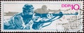 GERMANY, DDR - CIRCA 1967 : a postage stamp from Germany, GDR showing two athletes in prone shooting. Biathlon World Championships