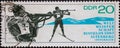 GERMANY, DDR - CIRCA 1967 : a postage stamp from Germany, GDR showing two athletes in standing shooting. Biathlon World Championsh