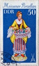 GERMANY, DDR - CIRCA 1979 : a postage stamp from Germany, GDR showing an ancient classic figure flower seller. Meissen porcelain