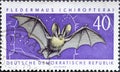 GERMANY, DDR - CIRCA 1962 : a postage stamp from Germany, GDR showing a bat Chiroptera in flight. Protected native animals