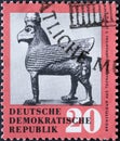 GERMANY, DDR - CIRCA 1959 : a postage stamp from Germany, GDR showing a bronze figure: horse with beak and wing from Toprak-Kale,