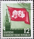 GERMANY, DDR - CIRCA 1953 : a postage stamp from Germany, GDR showing the Kremlin in Moscow, flag with head images of Marx, Engels Royalty Free Stock Photo