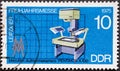 GERMANY, DDR - CIRCA 1975 : a postage stamp from Germany, GDR showing a microfilm camera `PENTAKTA A 100`. Leipzig Spring Fair