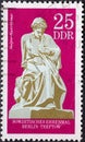 GERMANY, DDR - CIRCA 1970: a postage stamp from Germany, GDR showing the mother home, sculpture of the Soviet memorial in Berlin-T