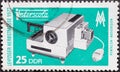 GERMANY, DDR - CIRCA 1972: a postage stamp from Germany, GDR showing a slide projector. Text: Leipzig Autumn Fair 1972
