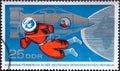 GERMANY, DDR - CIRCA 1965 : a postage stamp from Germany, GDR showing a stylized spaceship, cosmonauts with spacesuit, part of th