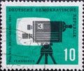 GERMANY, DDR - CIRCA 1961 : a postage stamp from Germany, GDR showing a television camera in front of a television screen. For the