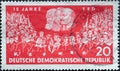 GERMANY, DDR - CIRCA 1961 : a postage stamp from Germany, GDR showing the union of two marches, portraits of Marx, Engels and Leni Royalty Free Stock Photo