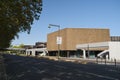 Facade and entrance of the CCD town hall, access road with green plants on