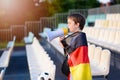 Germany fan screaming through megaphone on the stadium Royalty Free Stock Photo