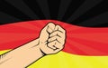 Germany fight protest symbol with strong hand and flag as background