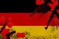 Germany flag and guns in red blood. Concept for terror attack and military operations