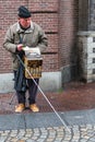 GERMANY, FRANKFURT: 12 DECEMBER 2016 - European street musicians who sitting on the pedestrian streets and playing music Royalty Free Stock Photo