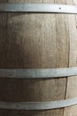 Germany. Heidelberg Castle. Fragment of an old wooden vine barrel with an metall hoop on a dark background. Wooden barrel with