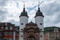Germany, Heidelberg city. Old Bridge with large arched Gate between two white Tower