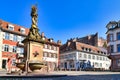 Germany, `Kornmarkt` square in old historical city center, fountain with golden Madonna statue and view on Heidelberg castle Royalty Free Stock Photo