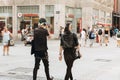 Young couple punks or friends walking down the street in Leipzig.