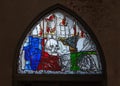 Germany, Lubeck. Stained glass window in St. Mary`s Church. Allegorical plot `Dance of Death` Royalty Free Stock Photo