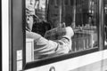 Germany, Munich, March 25, 2017, Older turk man is reading a turkish newspaper called hafta sonu in a tramway in munich