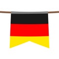 Germany national flags hangs on the ropes on white background. The symbol of the state in the pennant hanging on the rope. Royalty Free Stock Photo