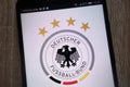 Germany national football team logo displayed on a modern smartphone