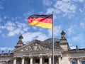 Germany Politics Concept: German Flag In Front of The Reichstag Building