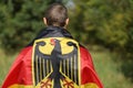 Germany silk flag on man`s shoulders Royalty Free Stock Photo