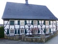 Bergisches rural half-timbered house with the typical green window shutters Royalty Free Stock Photo