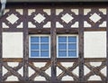 Germany, two windows of traditional decorated half-timbered house building