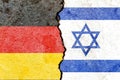 Germany vs Israel flags on cracked wall, political conflict concept Royalty Free Stock Photo