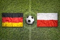 Germany vs. Poland flags on soccer field Royalty Free Stock Photo
