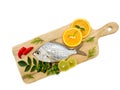 Gerres Fish Gerres Filamentosus , Whipfin silver biddy Fish , Decorated with curry Leaves and Tomato on a Wooden pad,White Royalty Free Stock Photo