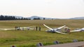 Gliders (sailplanes) ready for takeoff on Wasserkuppe airfield in RhÃ¶n Mountains.