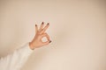 The gesture symbolizes agreement and approval. The thumb sign is easily recognized around the world. The thumb and index Royalty Free Stock Photo