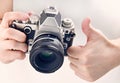 Gesture thumbs up and retro SLR camera isolated